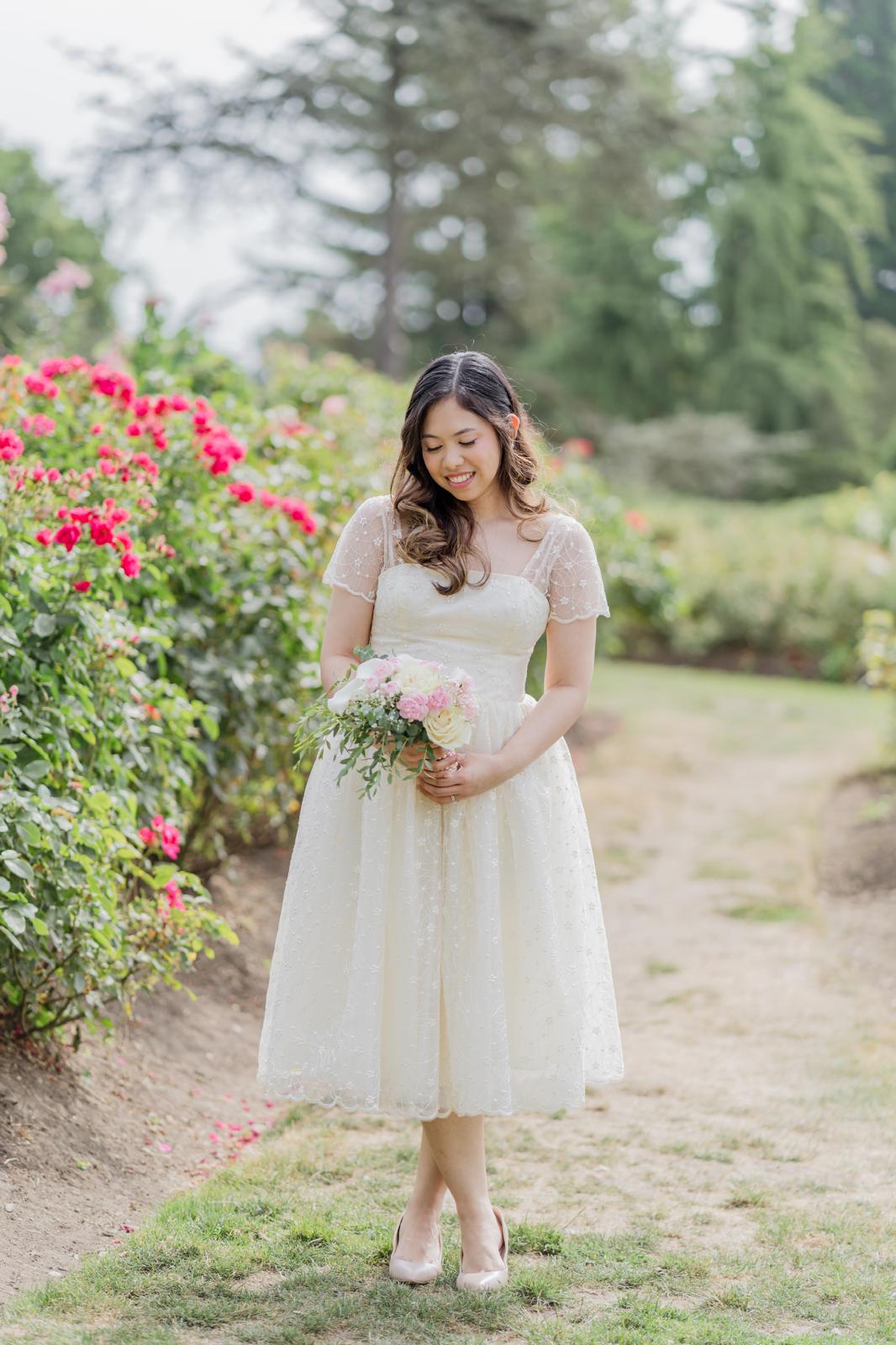 Bride walking a garden path