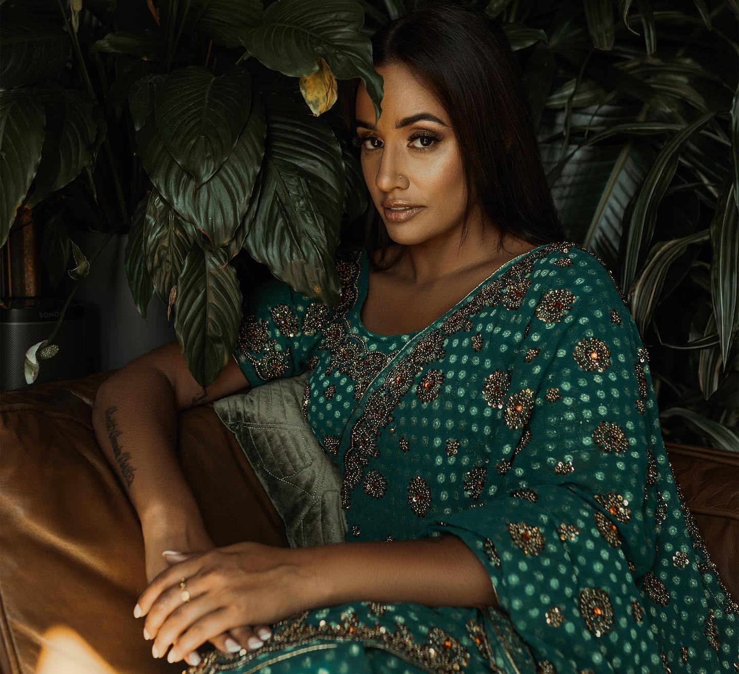South Asian bride in green embellished sari